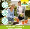 A mother and daughter are potting plants on a table outdoors. Produktbild-Vorschau