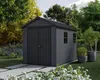 A dark gray garden shed with double doors and two small windows, set in a lush garden with trees, flowers, and paved pathways. Produktbild-Vorschau