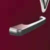 A close-up view of a silver refrigerator handle against a burgundy background. Produktbild-Vorschau