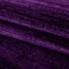 A close-up view of a folded purple carpet with a textured, patterned surface. Voir les images du produit