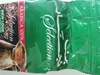 Close-up of a green coffee packaging with text and an image of coffee beans and a cezve. Produktbild-Vorschau