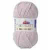 A ball of pink yarn with a label. Náhľad obrázku produktu