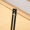 A close-up view of a black metal bracket with a silver wing nut attached to a wooden surface, likely part of a greenhouse or cold frame. Voir les images du produit