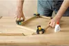 A person is using corner clamps to assemble a wooden frame. Produktbild-Vorschau