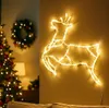 A Christmas-themed indoor scene with a lit reindeer silhouette, a Christmas tree, and a wreath. Produktbild-Vorschau