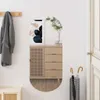 A hallway with a coat rack, a cabinet, and a mirror. Voir les images du produit