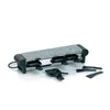 A raclette grill with four small pans and spatulas on a white background. Produktbild-Vorschau