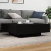 A modern living room with a gray sofa and a black coffee table. Produktbild-Vorschau