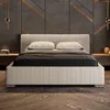 A modern bedroom with a bed, nightstands, and decorative wall panels. Produktbild-Vorschau