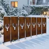 A row of decorative metal screens with deer head cutouts in a snowy garden. Produktbild-Vorschau