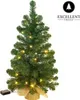 A small artificial Christmas tree with lights. Produktbild-Vorschau