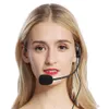 A woman wearing a headset microphone. Produktbild-Vorschau
