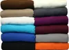 A stack of rolled up blankets in various colors. Produktbild-Vorschau