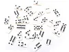 A collection of dominoes scattered on a white background. Náhľad obrázku produktu