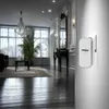A wireless doorbell receiver is mounted on a wall in a hallway of a luxurious home. Náhľad obrázku produktu