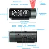 Diagrams and labels illustrating the features and dimensions of a digital projection alarm clock. Produktbild-Vorschau