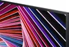 A close-up view of a monitor screen displaying a colorful abstract geometric pattern. Produktbild-Vorschau