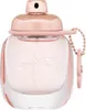 A close-up studio shot of a Coach Floral Eau de Parfum bottle. Voir les images du produit