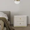 A bedside table next to a bed. Náhled obrázku produktu