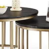 Two nesting round coffee tables with black marble-effect tops and gold metal frames, shown from a close-up angle. Voir les images du produit