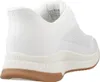 A side view of a white sneaker with a brown sole. Anteprima dell’immagine prodotto
