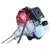 Close-up shot of a gasoline-powered string trimmer engine and fuel tank. Produktbild-Vorschau