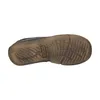 The sole of a brown shoe is shown against a white background. Voir les images du produit