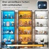 Three display cabinets filled with various items, showcasing different LED lighting colors and brightness adjustments. Náhľad obrázku produktu