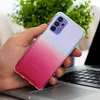 A hand holding a phone case with a gradient color. Produktbild-Vorschau