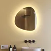 A bathroom scene with a sink, faucet, soap dispensers, and an illuminated mirror. Produktbild-Vorschau