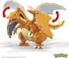A toy buildable model of the Pokémon Charizard, shown with articulated wings and tail flame. Voir les images du produit