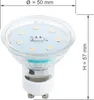 A close-up, angled view of an LED light bulb with measurement indicators. Produktbild-Vorschau