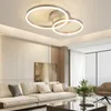 A modern living room with a large sectional sofa, abstract art on the wall, and a contemporary ceiling light. Podgląd zdjęcia produktu