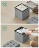Collage showing a fabric storage ottoman being used to store clothes and books. Produktbild-Vorschau