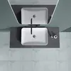 A top-down view of two modern bathroom sinks on a dark countertop, with a reflective surface above. Produktbild-Vorschau