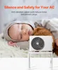 A sleeping baby is next to an air conditioner unit on a stand. Anteprima dell’immagine prodotto