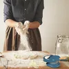 A person is making dough and dumplings. Podgląd zdjęcia produktu