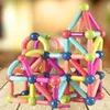 A colorful magnetic building block structure resembling a house, placed on a wooden surface. Náhled obrázku produktu