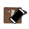 A brown leather wallet case for a smartphone, with a credit card and cash inside. Produktbild-Vorschau