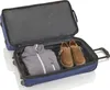 An open blue suitcase with a gray jacket and two brown shoes inside. Produktbild-Vorschau
