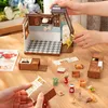 A miniature DIY dollhouse kitchen set with various accessories laid out on a wooden table. Náhľad obrázku produktu