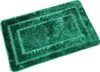 A green bath mat with a textured surface and a rectangular design. Náhled obrázku produktu