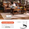 A family and their dog are relaxing in a living room while a robot vacuum cleans the floor. Produktbild-Vorschau