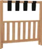 A luggage rack made of bamboo with black straps. Voir les images du produit