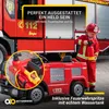 A child dressed as a firefighter plays with a toy fire truck, holding a toy fire extinguisher. Produktbild-Vorschau
