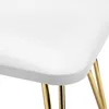 A close-up view of the corner of a white product with gold legs. Anteprima dell’immagine prodotto