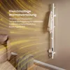 A white electric towel rack with a towel hanging on it, placed in a room with a sofa and ottoman. The background has a graphic overlay of golden light streaks. Produktbild-Vorschau
