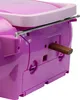 A close-up view of the back of a pink and purple boombox, showing a wooden dowel inserted into a port. Produktbild-Vorschau