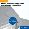 Close-up of a refrigerator's door hinge and top surface. Produktbild-Vorschau