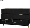 A black dresser with gold handles is shown against a white background. Dimensions are indicated with lines and numbers. Produktbild-Vorschau